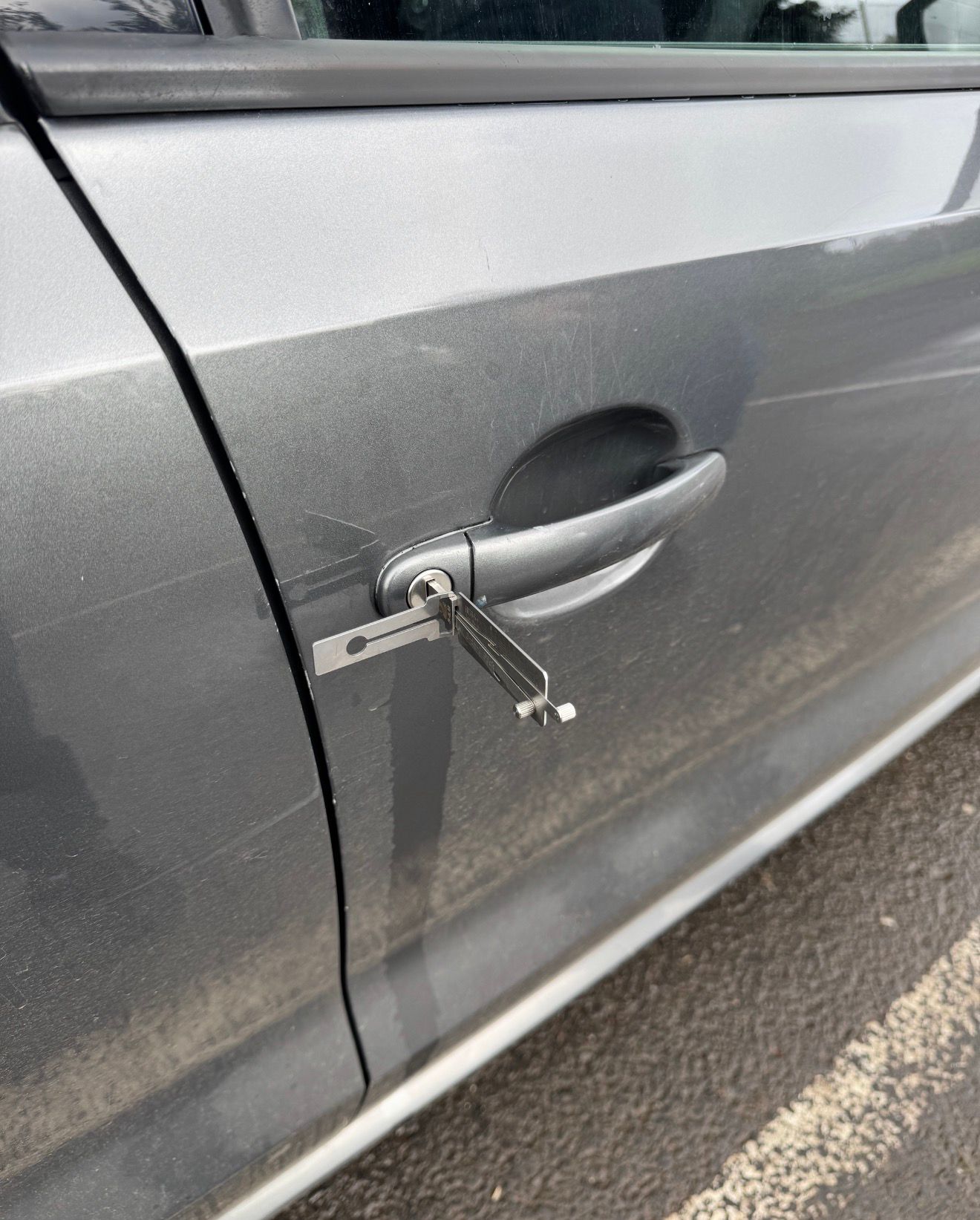 Mobile auto lock picking service opening a locked car door in Belfast